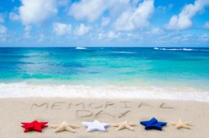 Memorial day background on the sandy beach near ocean